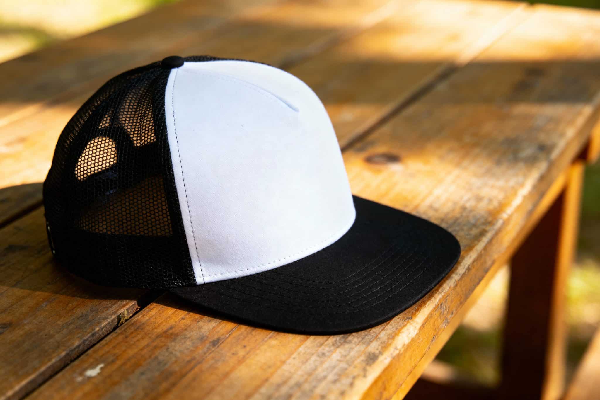 white and black trucker hat